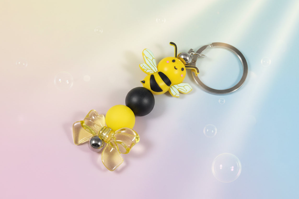 Whether you're keeping track of your keys or adding flair to your favourite bag, this cheerful bee keychain brings a pop of colour and charm to your daily routine.