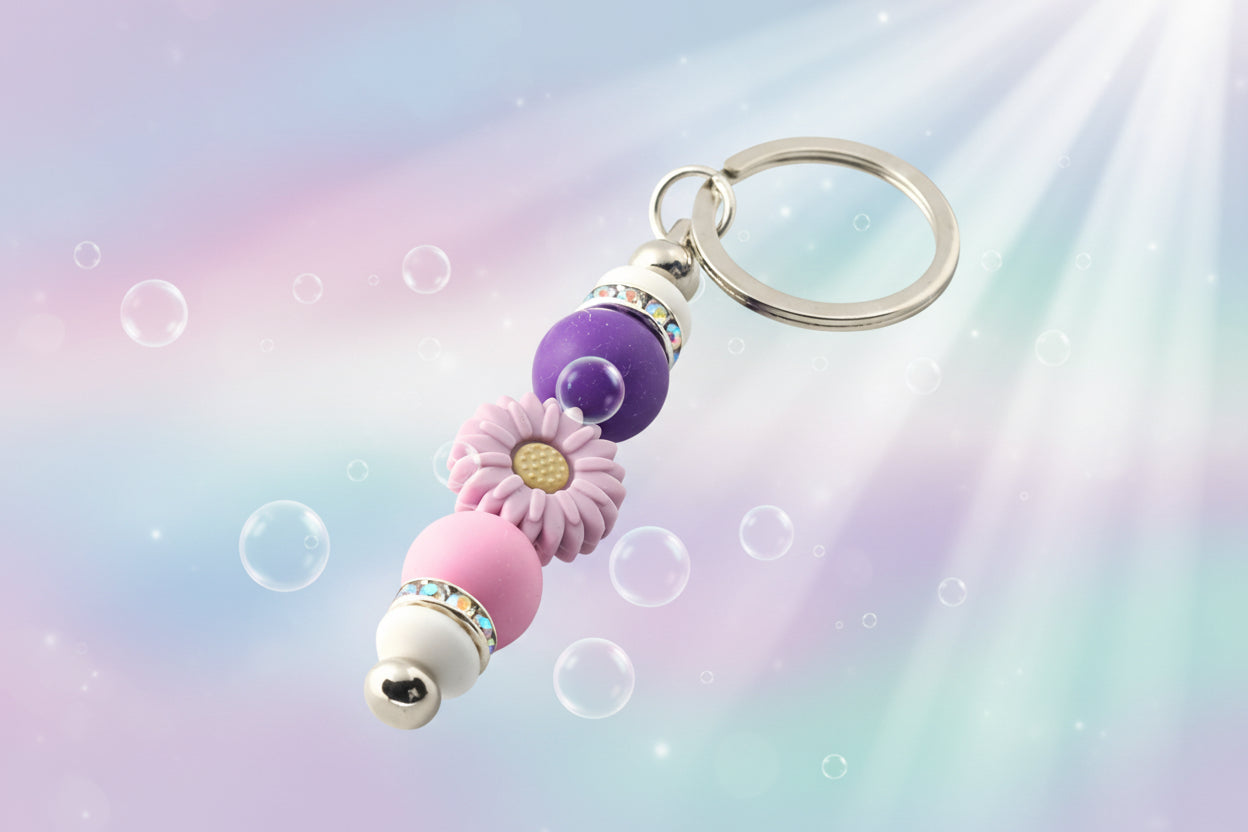 Whether you're keeping track of your keys or adding a decorative touch to your favourite bag, this lovely lilac daisy keychain brings a splash of floral charm and personality to your daily routine.