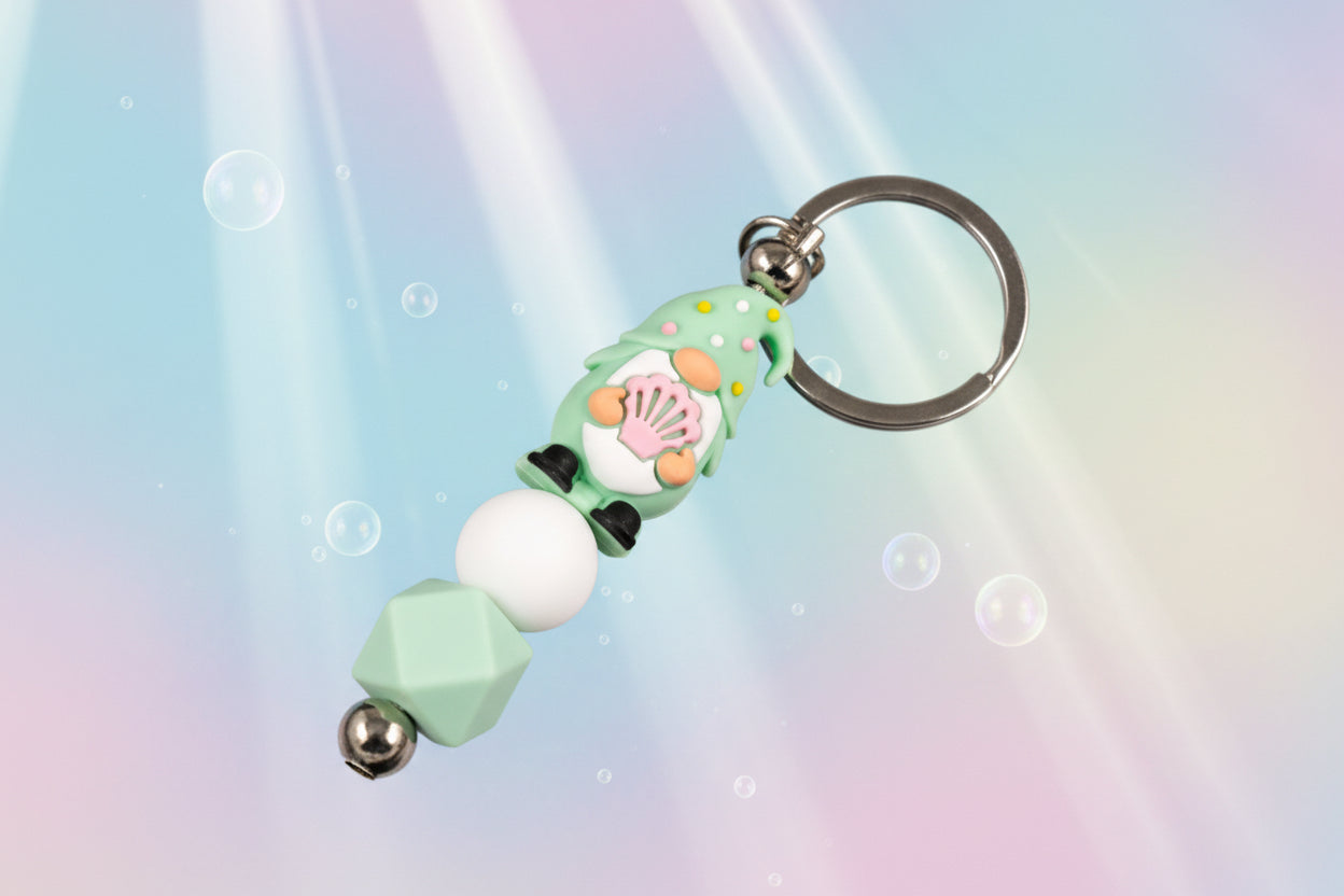 Whether you're keeping track of your keys or adding a magical touch to your favourite bag, this delightful green gnome keychain brings charm, character, and a hint of enchantment to your daily routine.