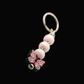 A pink butterfly charm keychain with pearlescent silicon beads and sparkly rondelles