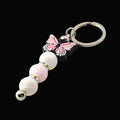 Keychain with pink butterfly and pink and white beads and sparkly rondelles