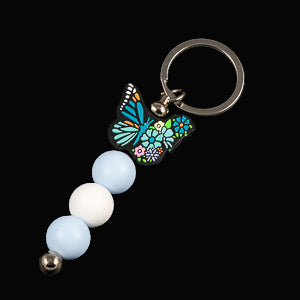 Multicoloured butterfly charm keychain with blue and white beads 
