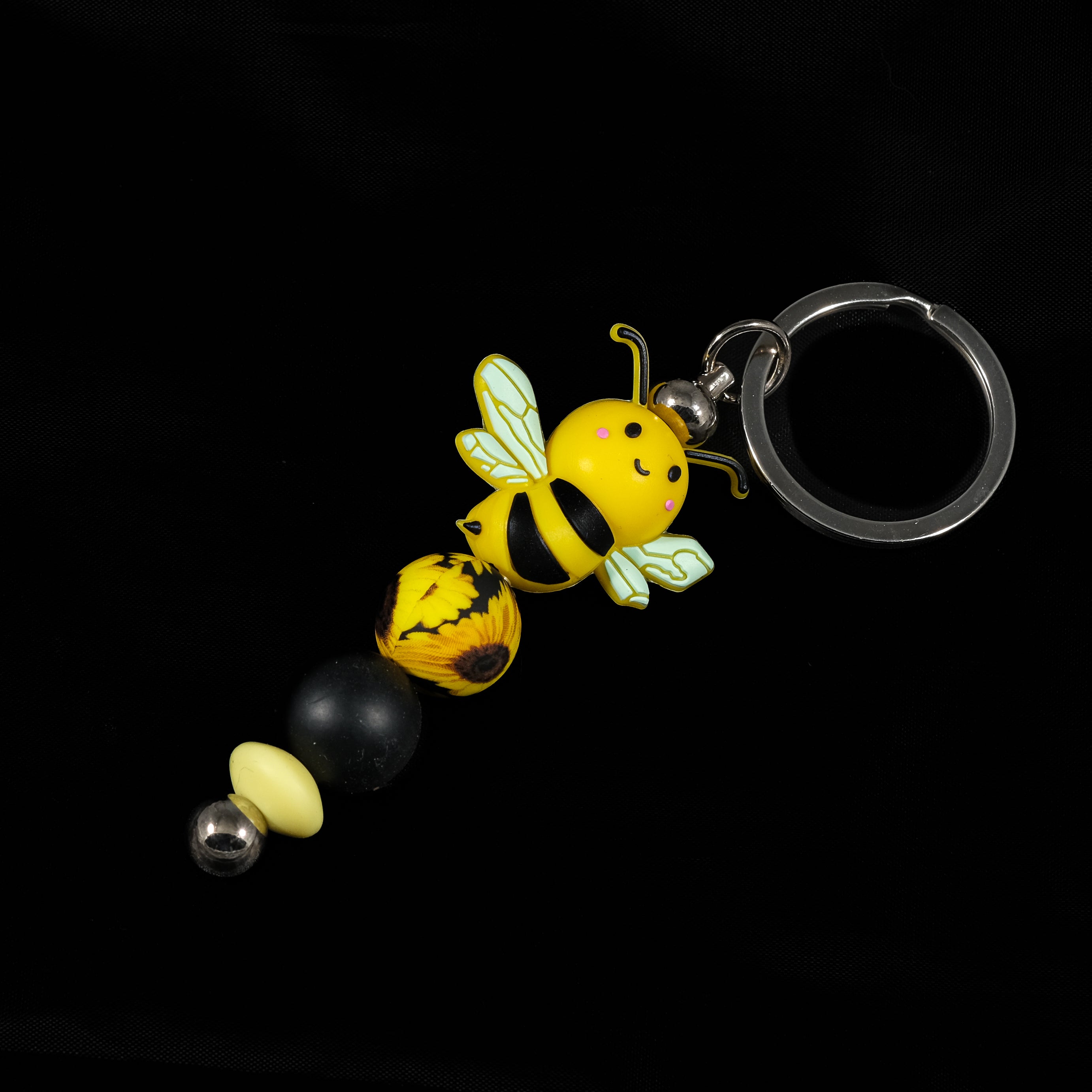 Whether you're keeping track of your keys or adding flair to your favourite bag, this cheerful bee keychain brings a pop of colour and charm to your daily routine.