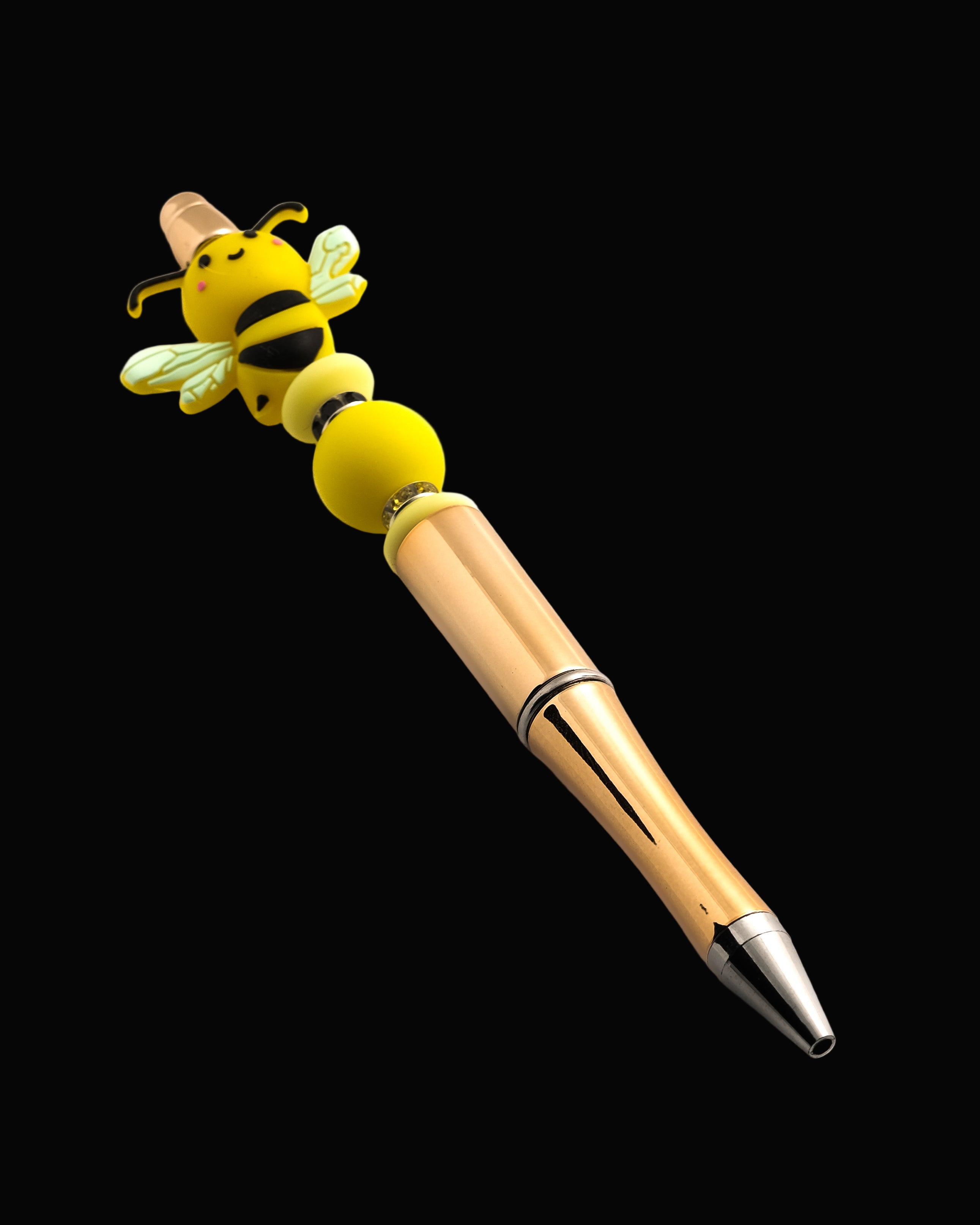 Gold pen with yellow stackable beads with black and yellow rondelles and a Bee shaped bead