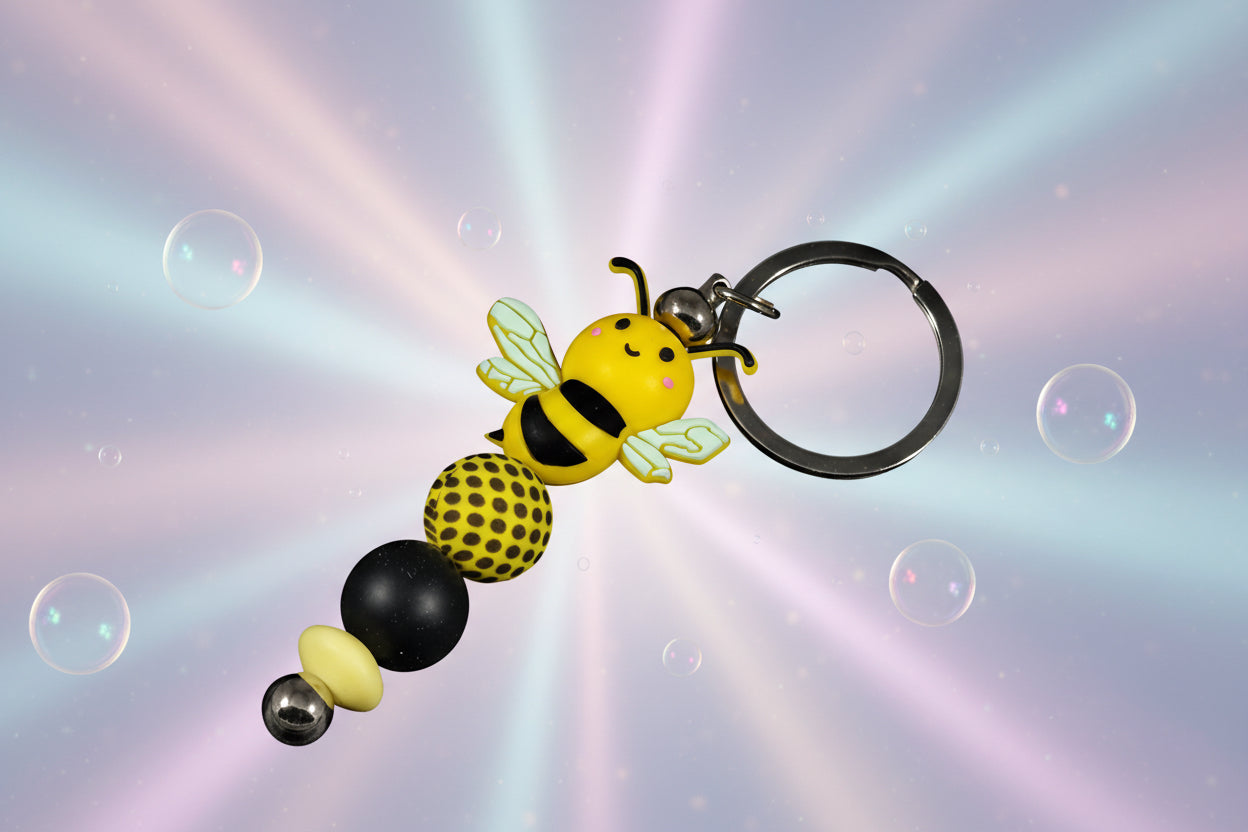 Whether you're keeping track of your keys or adding flair to your favourite bag, this cheerful bee keychain brings a pop of colour and charm to your daily routine.