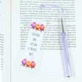 Acrylic bookmark with cute cartoon birds and inspirational quote 'Feathers and fiction: A perfect nest'. Perfect gift for book lovers. Durable, lightweight design from Georgie's Grove
