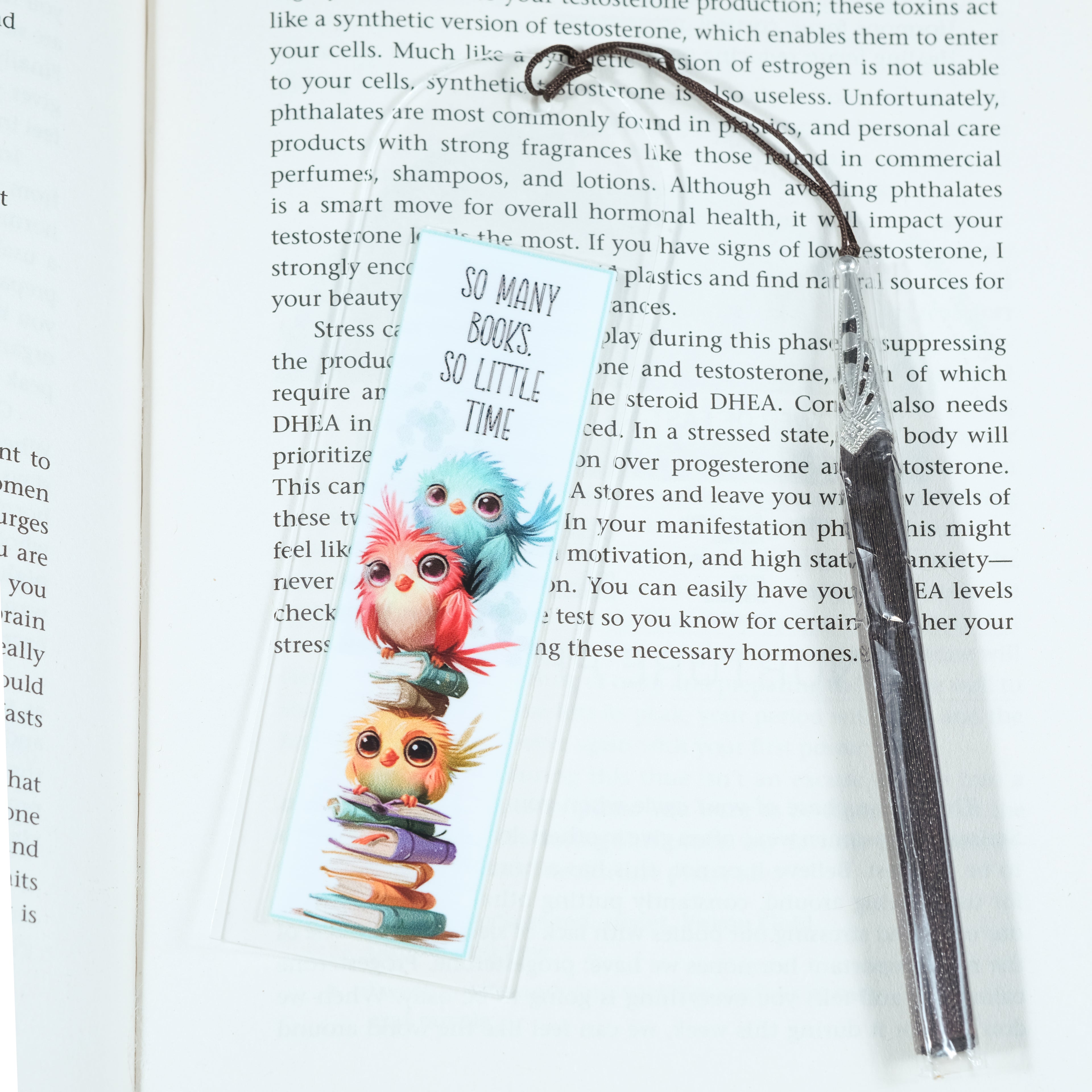 Acrylic bookmark with cute cartoon birds and inspirational quote 'So many books, so little time'. Perfect gift for book lovers. Durable, lightweight design from Georgie's Grove