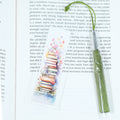 Mark your place in style! This cheerful acrylic bookmark features a delightful design of books and flowers that celebrates the joy of reading.