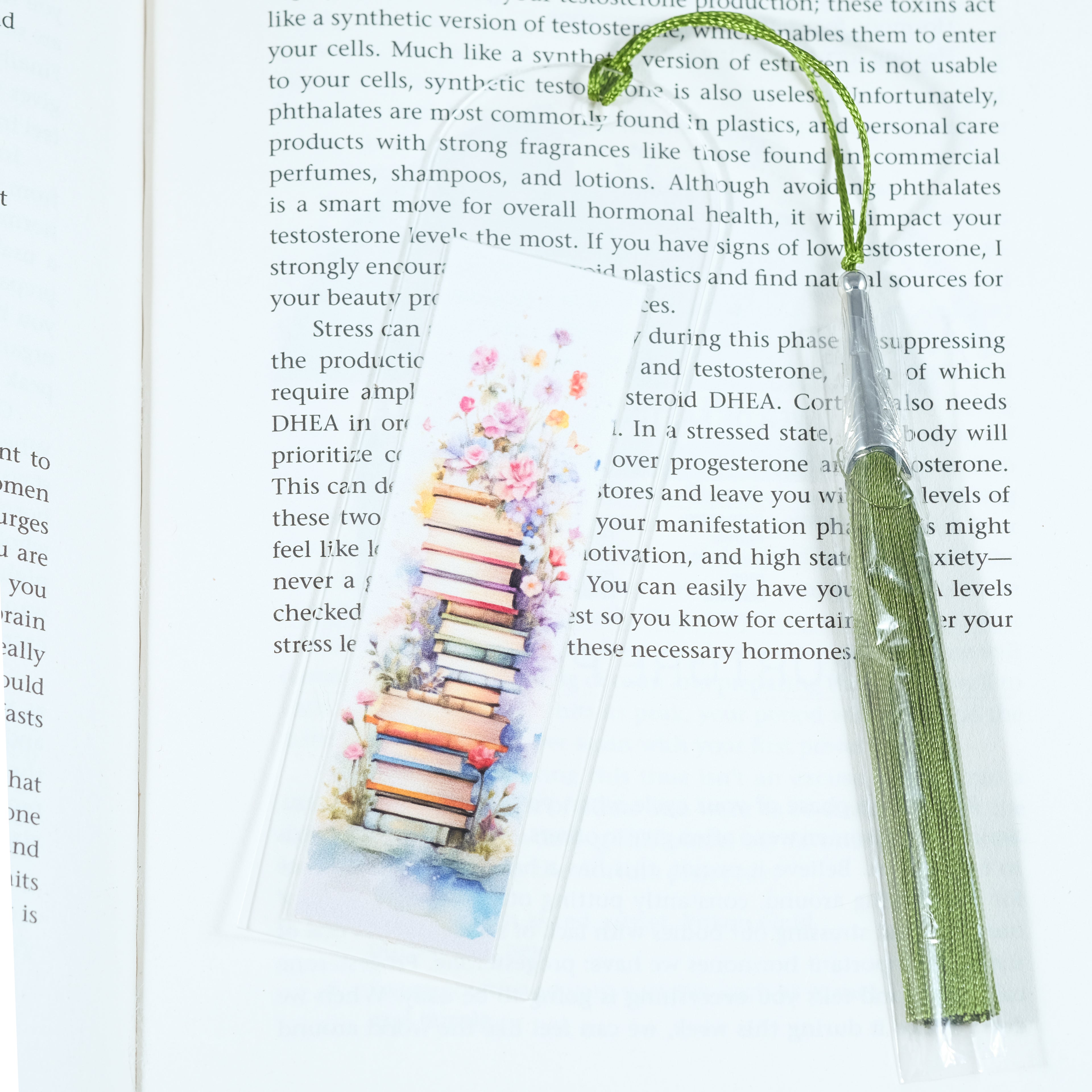 Mark your place in style! This cheerful acrylic bookmark features a delightful design of books and flowers that celebrates the joy of reading.