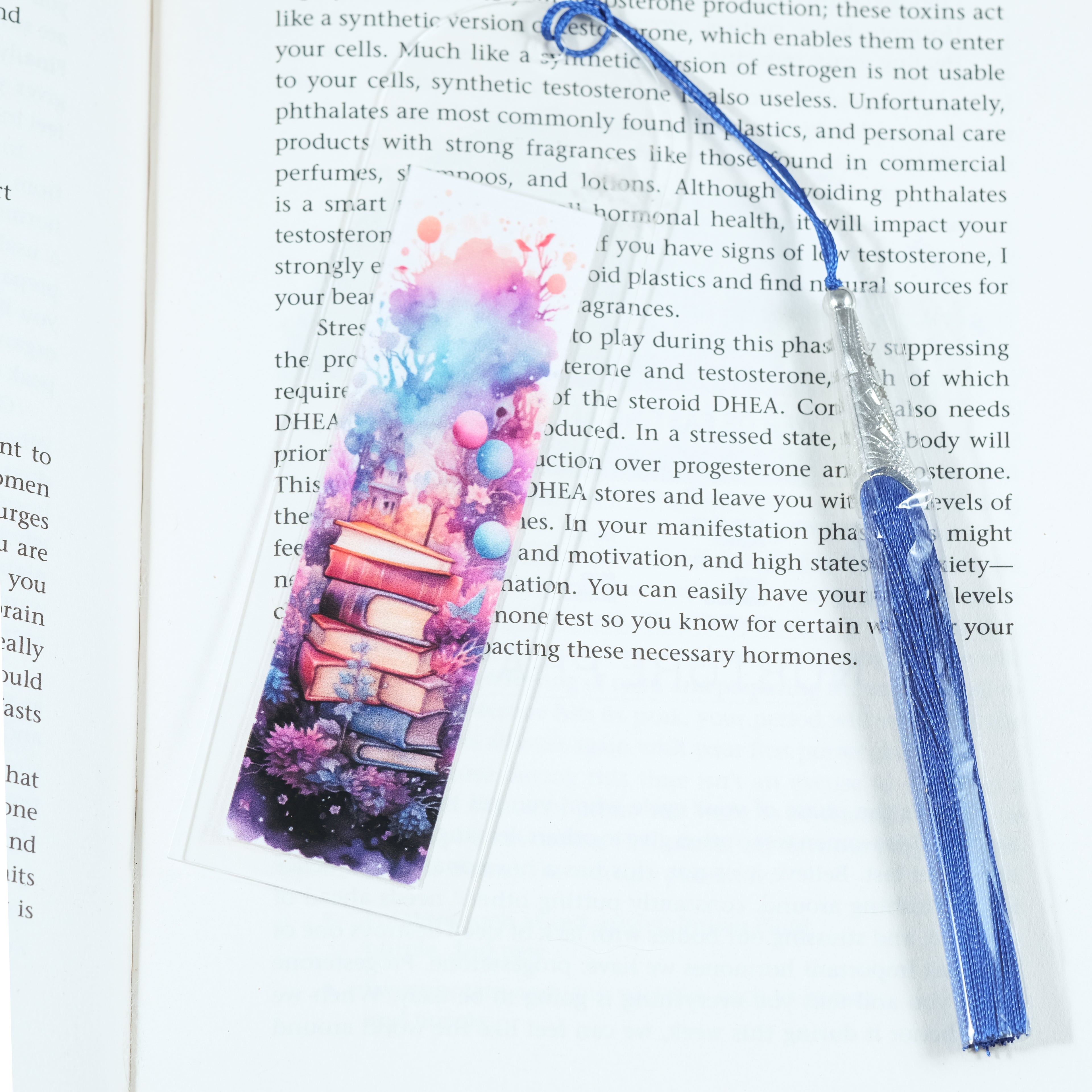 Mark your place in style! This cheerful acrylic bookmark features a delightful design of books and flowers that celebrates the joy of reading.