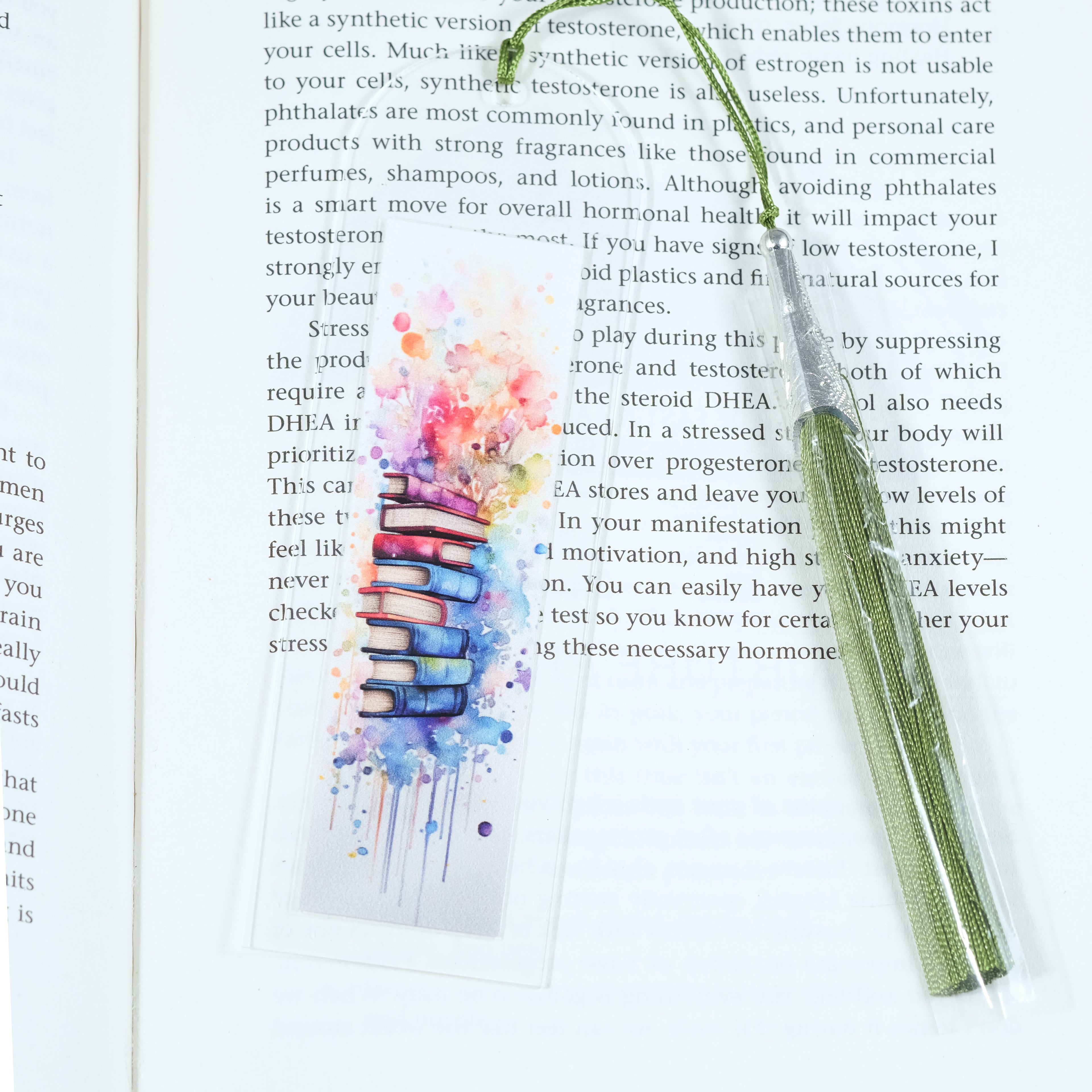 Mark your place in style! This cheerful acrylic bookmark features a delightful design of books and flowers that celebrates the joy of reading.
