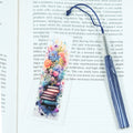 Mark your place in style! This cheerful acrylic bookmark features a delightful design of books and flowers that celebrates the joy of reading.