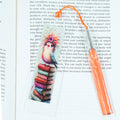 Whether you're escaping into a novel, browsing your favourite reads, or building your to-be-read pile, this fun bookmark brings a splash of colour and personality to every page.