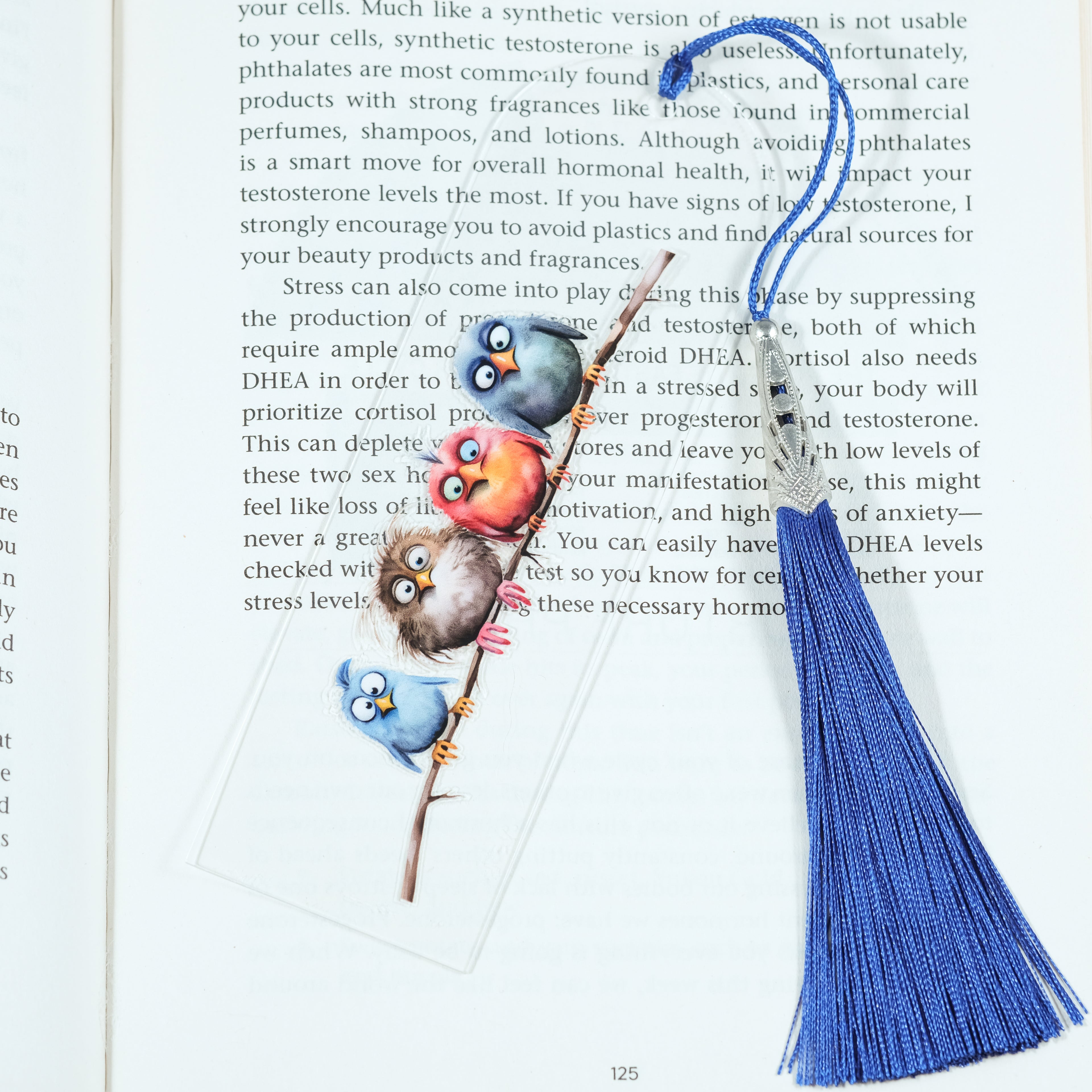 Add a splash of whimsy to your reading with this delightful Crazy Birds on a Branch acrylic bookmark! Featuring a playful design of quirky, characterful birds perched along a branch, this bookmark brings personality and charm to every page you turn.