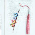 Add a splash of whimsy to your reading with this delightful Crazy Birds on a Branch acrylic bookmark! Featuring a playful design of quirky, characterful birds perched along a branch, this bookmark brings personality and charm to every page you turn.