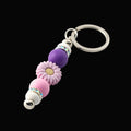 Whether you're keeping track of your keys or adding a decorative touch to your favourite bag, this lovely lilac daisy keychain brings a splash of floral charm and personality to your daily routine.