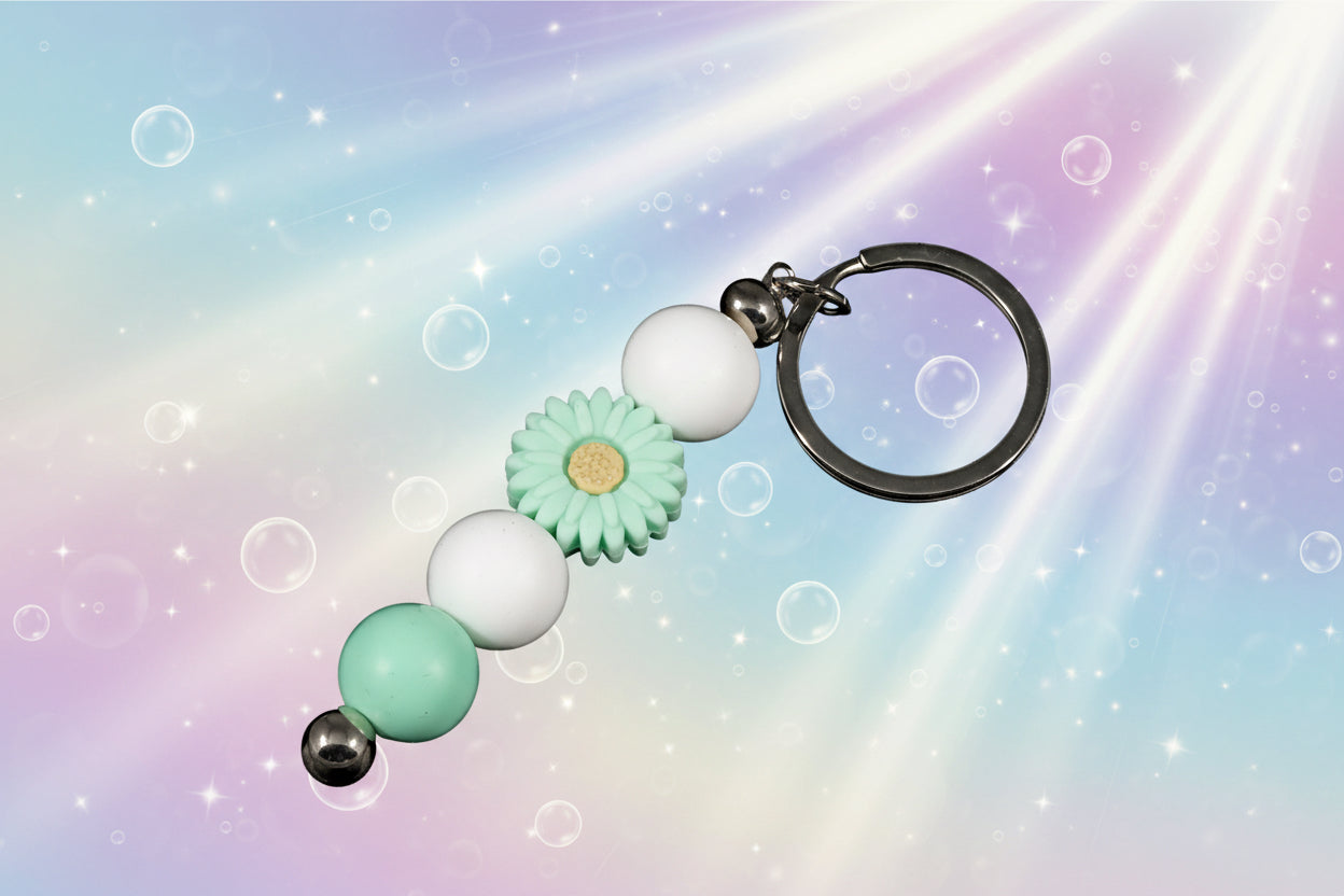 Whether you're keeping track of your keys or adding a decorative touch to your favourite bag, this lovely green daisy keychain brings a splash of floral charm and personality to your daily routine.