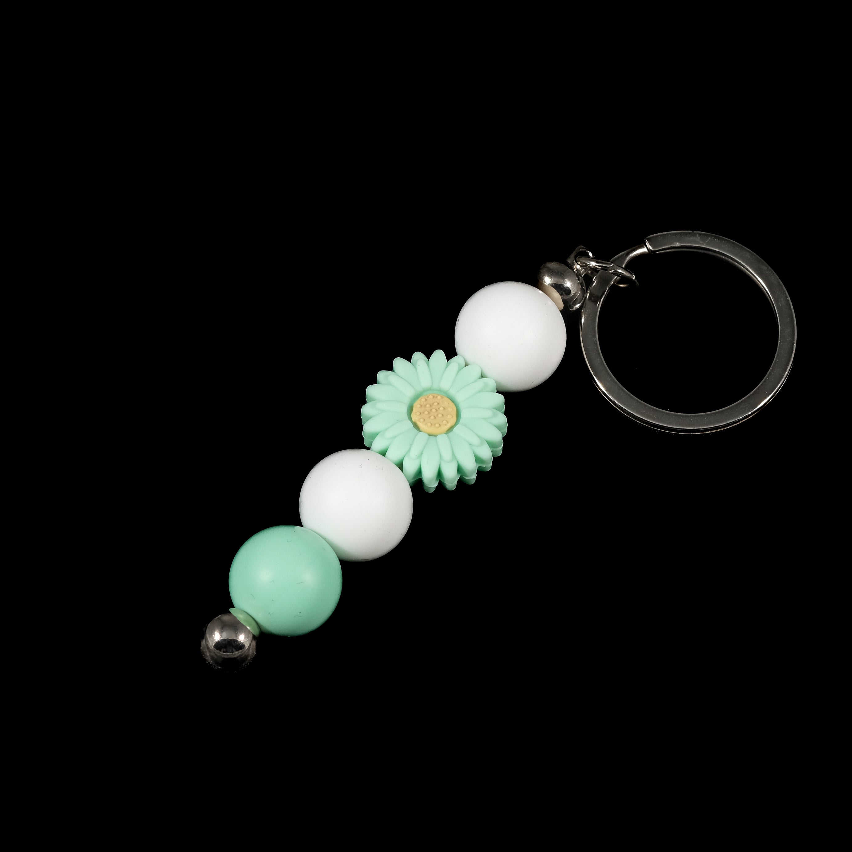 Whether you're keeping track of your keys or adding a decorative touch to your favourite bag, this lovely green daisy keychain brings a splash of floral charm and personality to your daily routine.