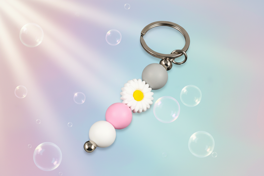 Whether you're keeping track of your keys or adding a decorative touch to your favourite bag, this lovely green daisy keychain brings a splash of floral charm and personality to your daily routine.