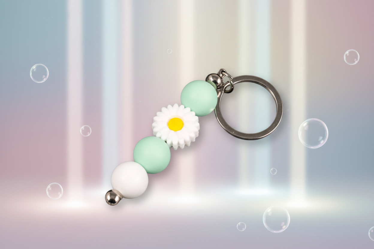 Whether you're keeping track of your keys or adding a decorative touch to your favourite bag, this lovely green daisy keychain brings a splash of floral charm and personality to your daily routine.