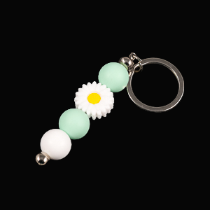 Whether you're keeping track of your keys or adding a decorative touch to your favourite bag, this lovely green daisy keychain brings a splash of floral charm and personality to your daily routine.