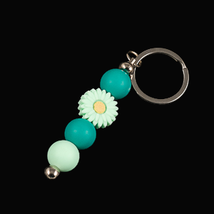 Whether you're keeping track of your keys or adding a decorative touch to your favourite bag, this lovely green daisy keychain brings a splash of floral charm and personality to your daily routine.