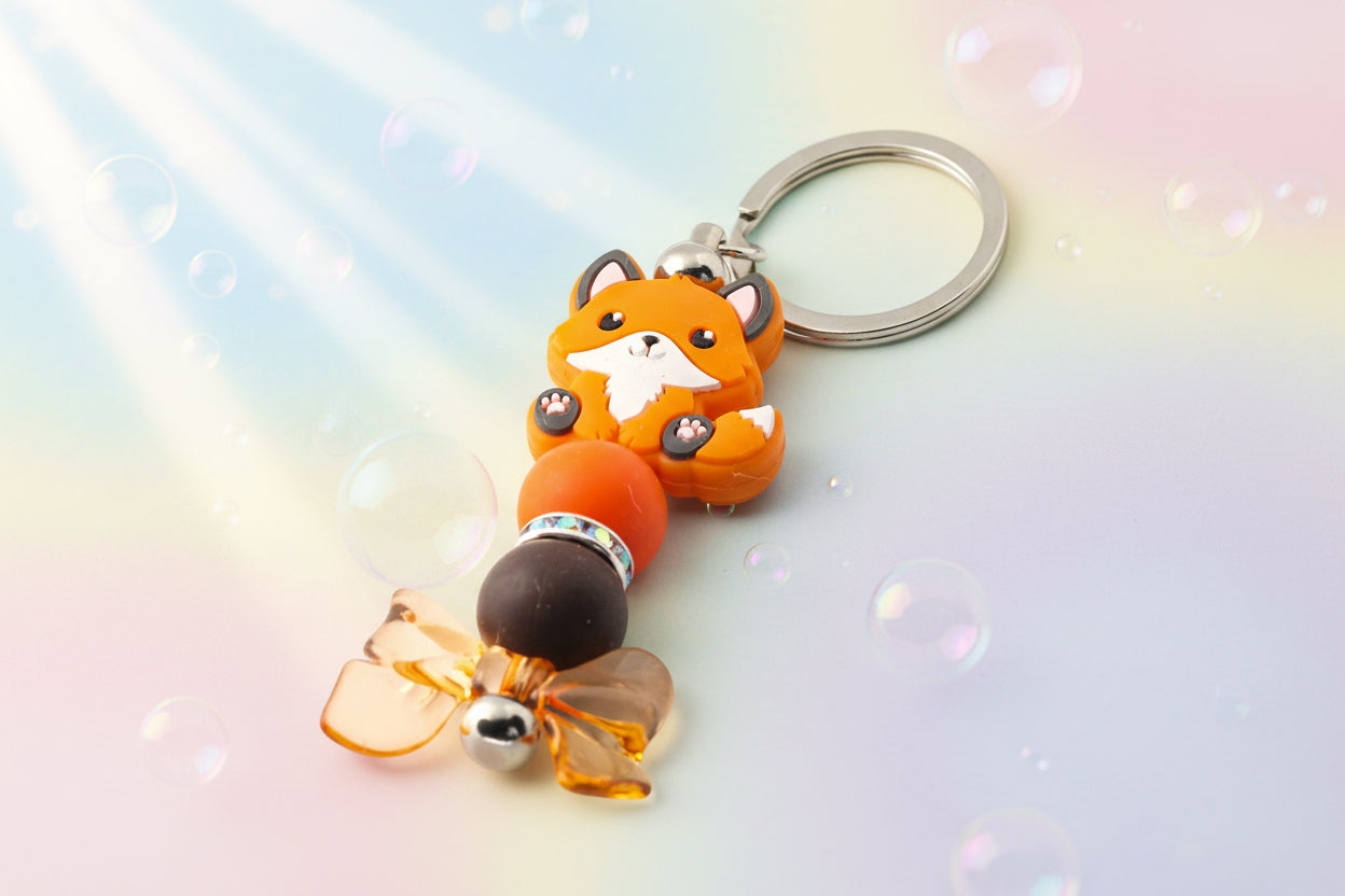 Fox and bow charm keychain with orange and brown beads and sparkly rondelles