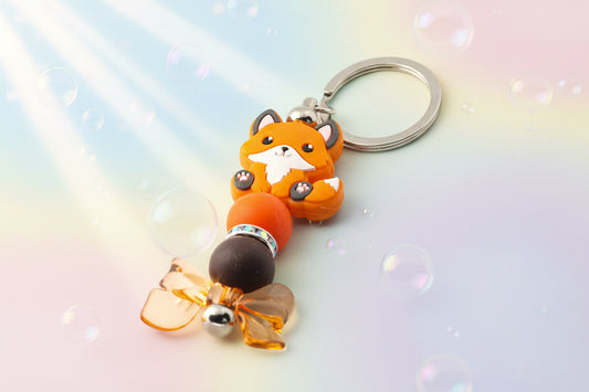 Fox and bow charm keychain with orange and brown beads and sparkly rondelles