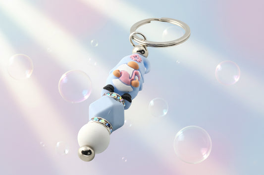 Whether you're keeping track of your keys or adding a magical touch to your favourite bag, this delightful blue gnome keychain brings charm, character, and a hint of enchantment to your daily routine.