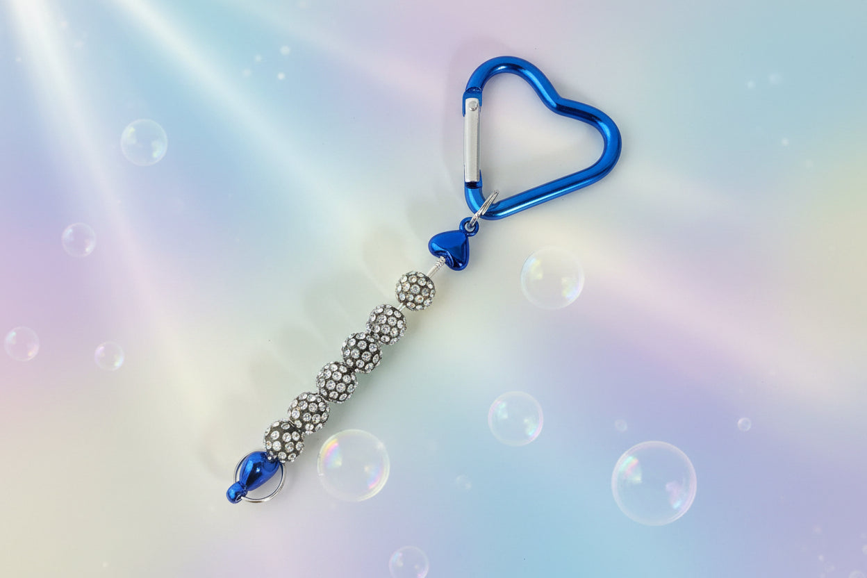 Add a touch of sparkle and love to your everyday essentials with this charming dark blue heart keychain. Adorned with shimmering beads, this delightful accessory brings personality and joy to your keys, bag, or backpack.