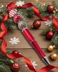 A Metallic Red Pen with wooden candy cane beads with a Xmas theme