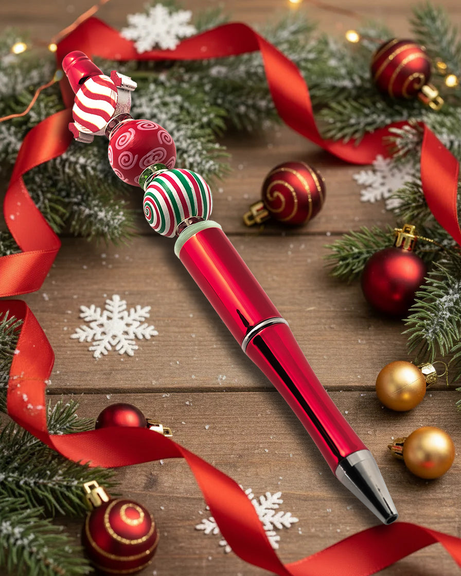 A Metallic Red Pen with wooden candy cane beads with a Xmas theme