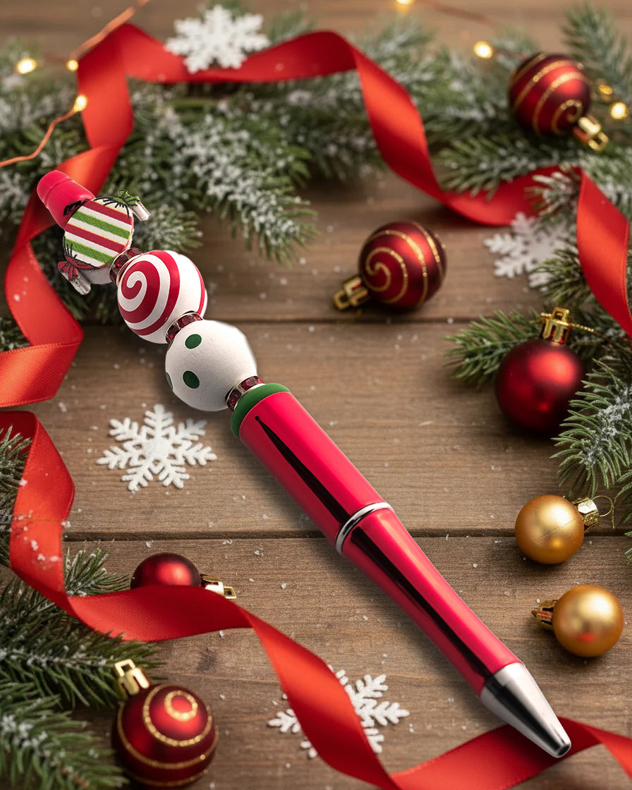 A Metallic Red Pen with wooden candy cane beads with a Xmas theme